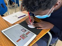Students learn to write the blessing words in Chinese during lesson